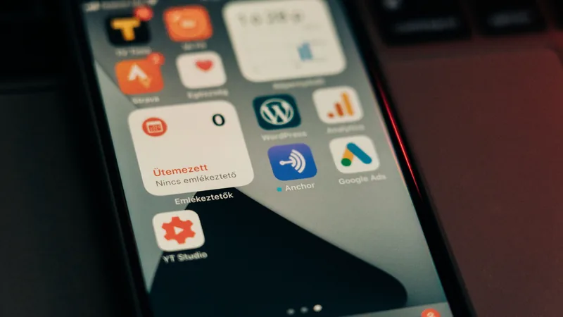 A close-up of a smartphone screen shows app icons and notifications, representing real-time omnichannel customer messaging.