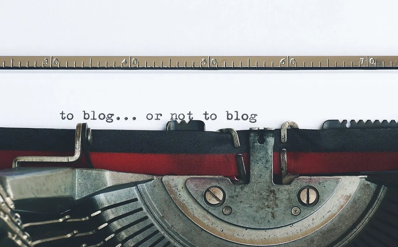A typewriter typing the words "to blog... or not to blog" showing the dilemma of SEO blog best practices