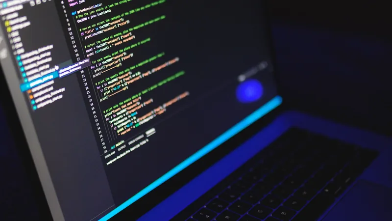 A laptop displays a code editor at night, the kind of late testing session where automated WordPress MCP workflows get checked on staging before anything touches the live site.