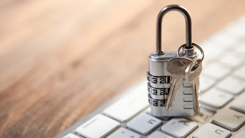 A padlock and keys resting on a keyboard, symbolizing the HTTPS padlock check for site security
