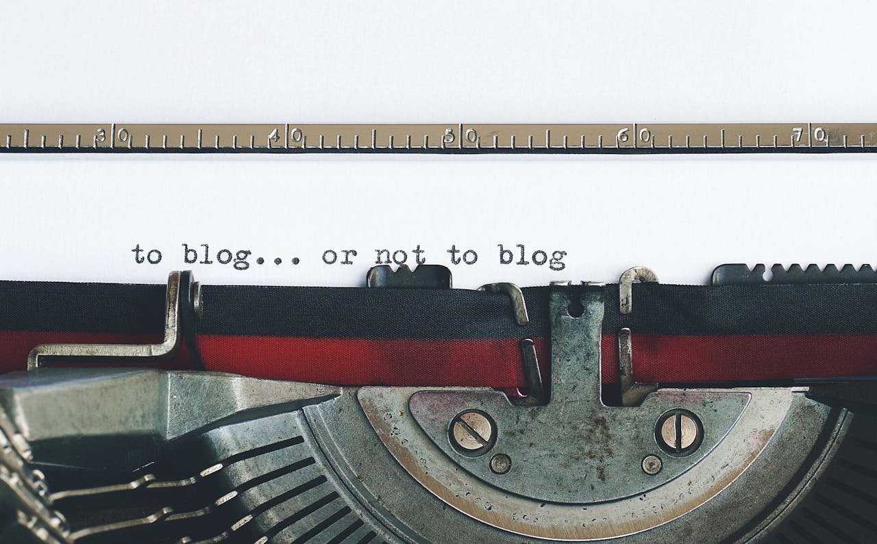 A typewriter typing the words "to blog... or not to blog" showing the dilemma of SEO blog best practices